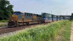 CSX 3124 leads a train of many types of freight. M331.